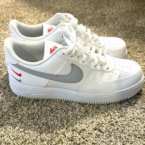 Men’s white Air Force 1.  Worn once. Size 10.5. Orange swoosh